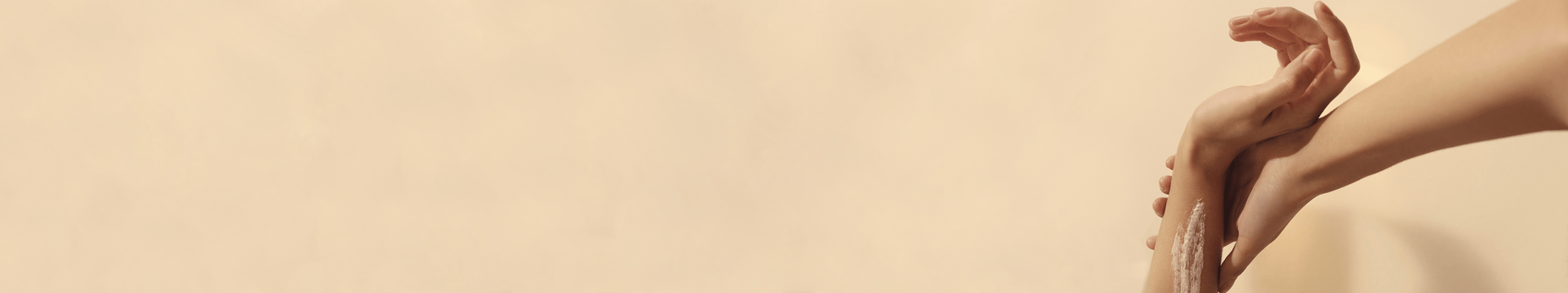 Kama model with cream on her wrist